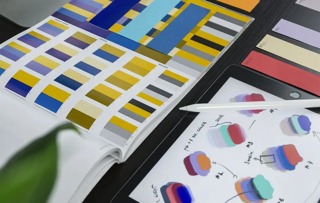 Colour palette and brand swatches on a desk